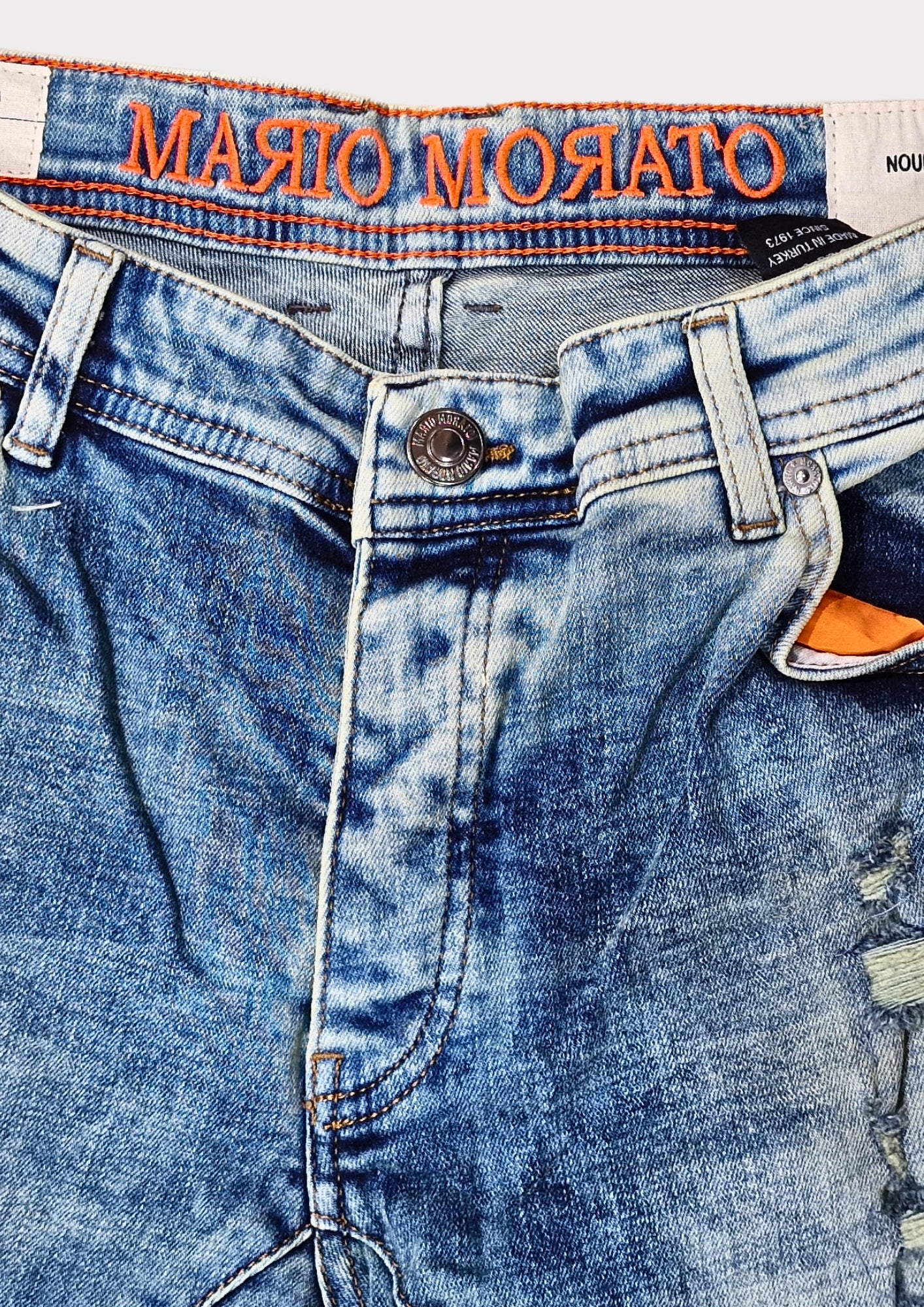 MARIO MORATO Distressed Light Wash Jeans: Rebel Edge Meets Refined Style