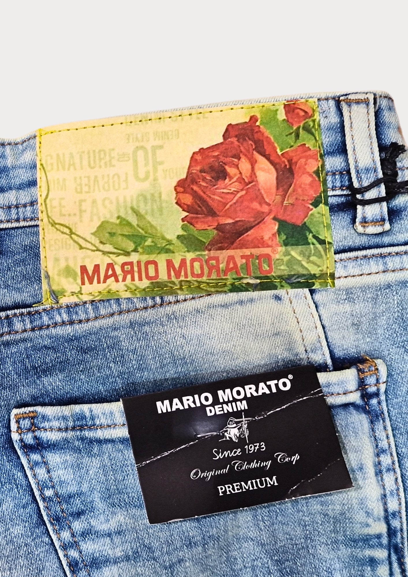 MARIO MORATO Distressed Light Wash Jeans: Rebel Edge Meets Refined Style
