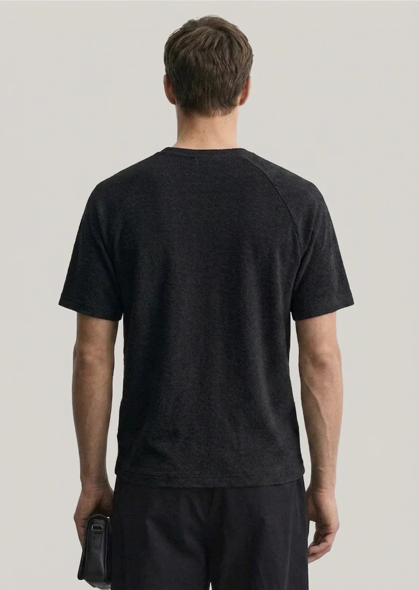 Black Clique Sedley Camden T-Shirt featuring a subtle Firefly GeminiFlash graphic on the front.