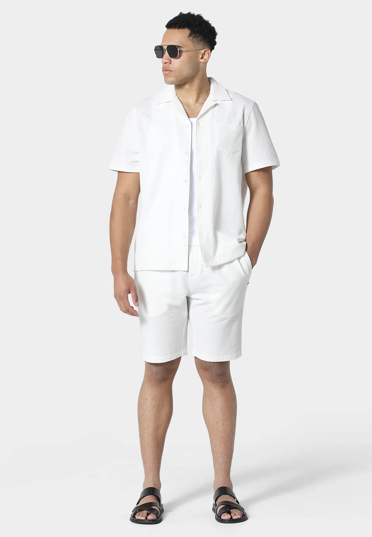 Clique 883Police Hullton white short-sleeves shirt with collar and button front, displayed on a hanger.