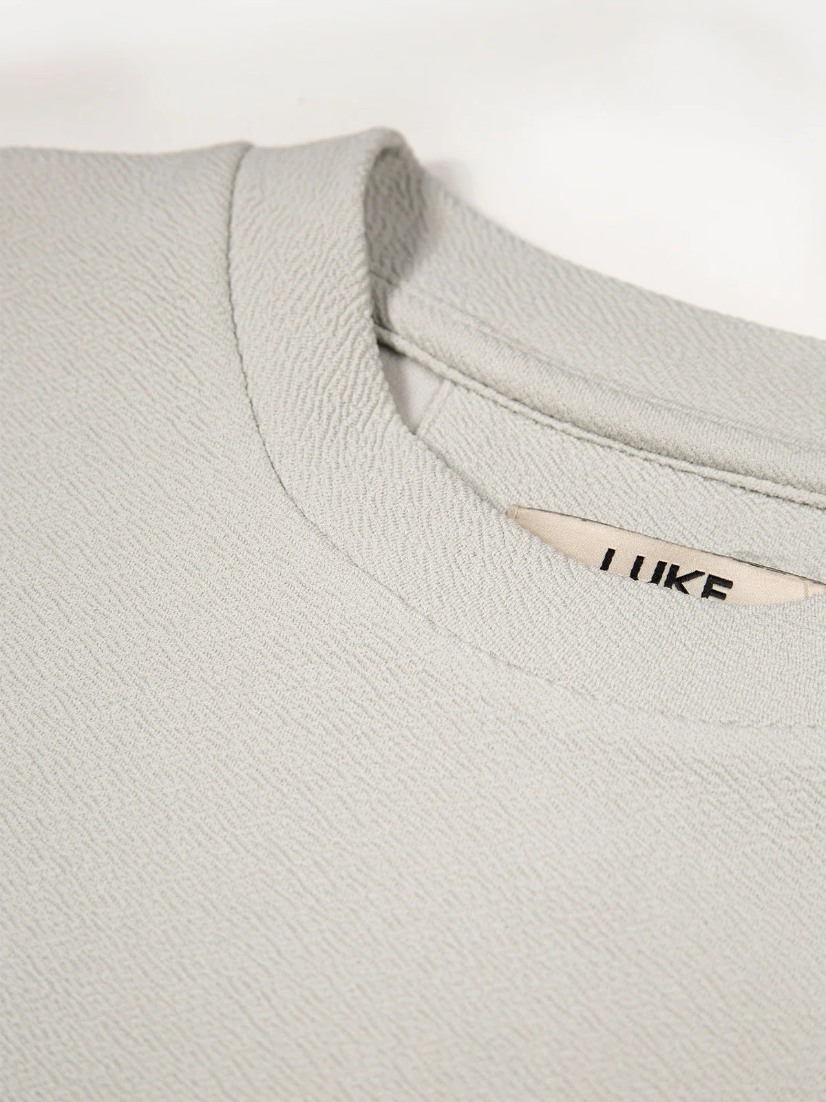Luke 1977 Mykynos men's crinkle textured T-shirt in ice grey, casual fit, made by Clique, with visible textured fabric and neckline.