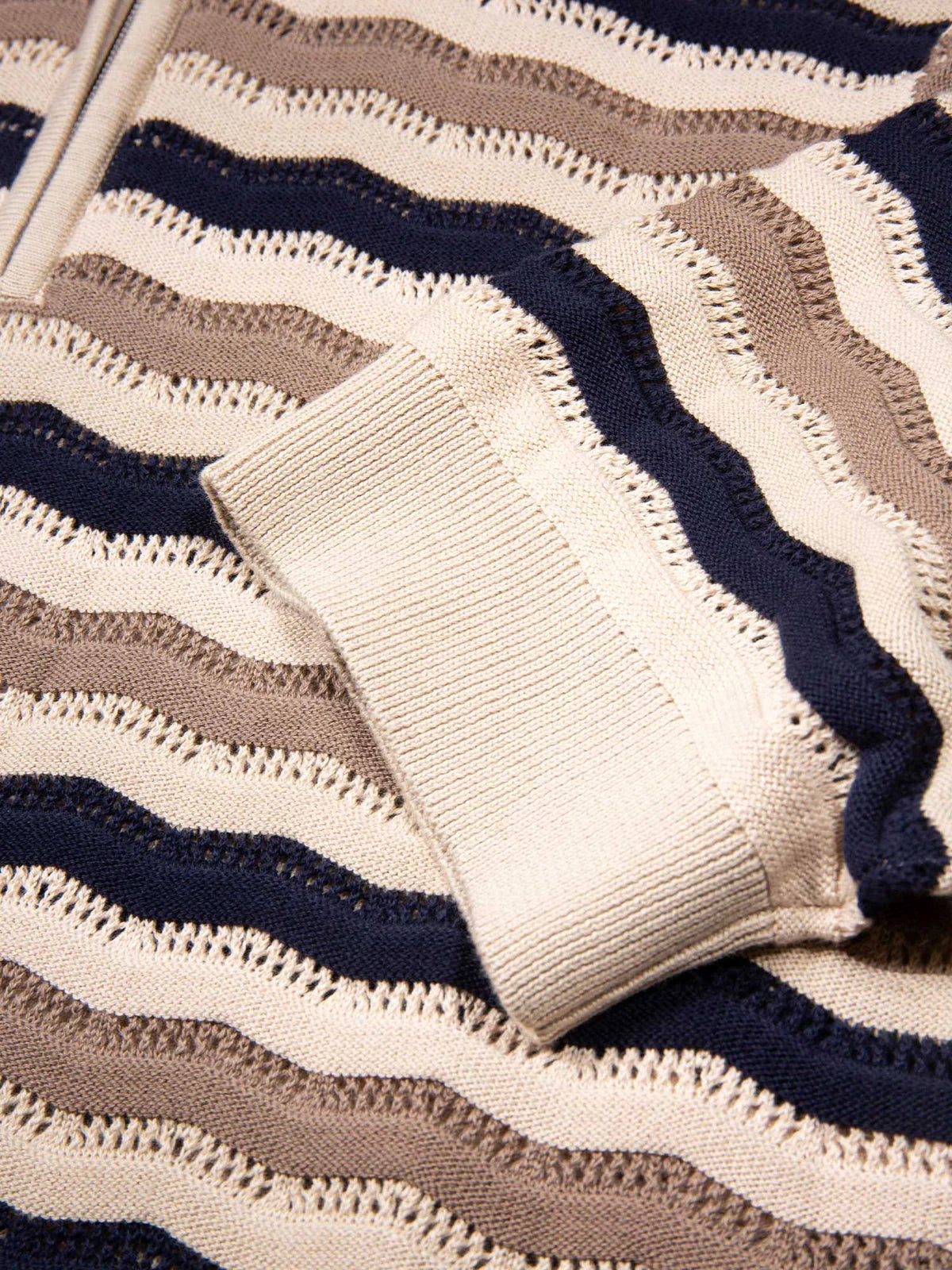 Navy and tan textured knit polo shirt from Luke 1977 Maughold collection, made of soft knit fabric, displayed on a white background.