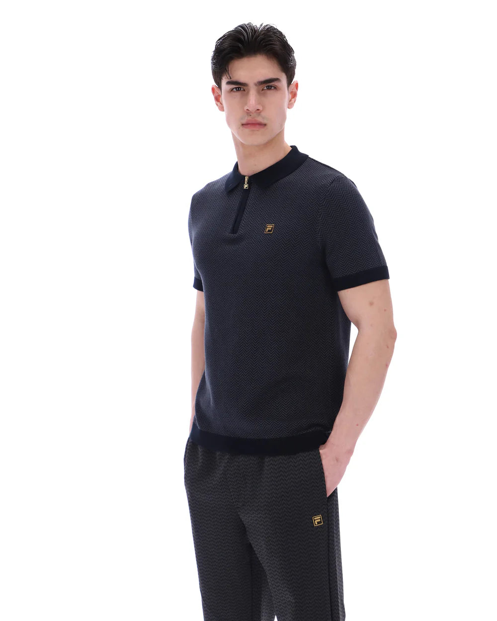 FILA Marty zip polo shirt with herringbone pattern in black and grey, by Clique, featuring a front zipper and classic collar.