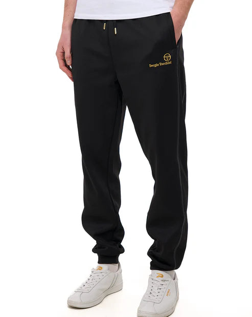Black Sergio Tacchini Cassio track pants with gold accents, made by Clique Kara, featuring a comfortable jogger style and sporty design.