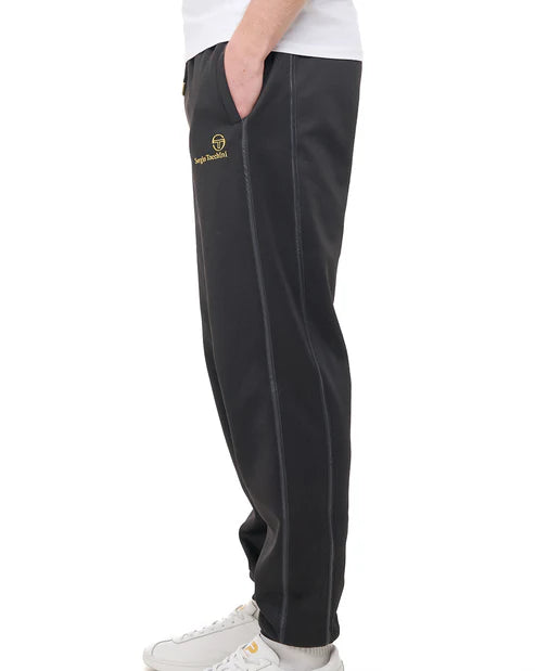 Black Sergio Tacchini Cassio track pants with gold accents, featuring a sporty fit and logo details, designed for comfortable athletic wear.