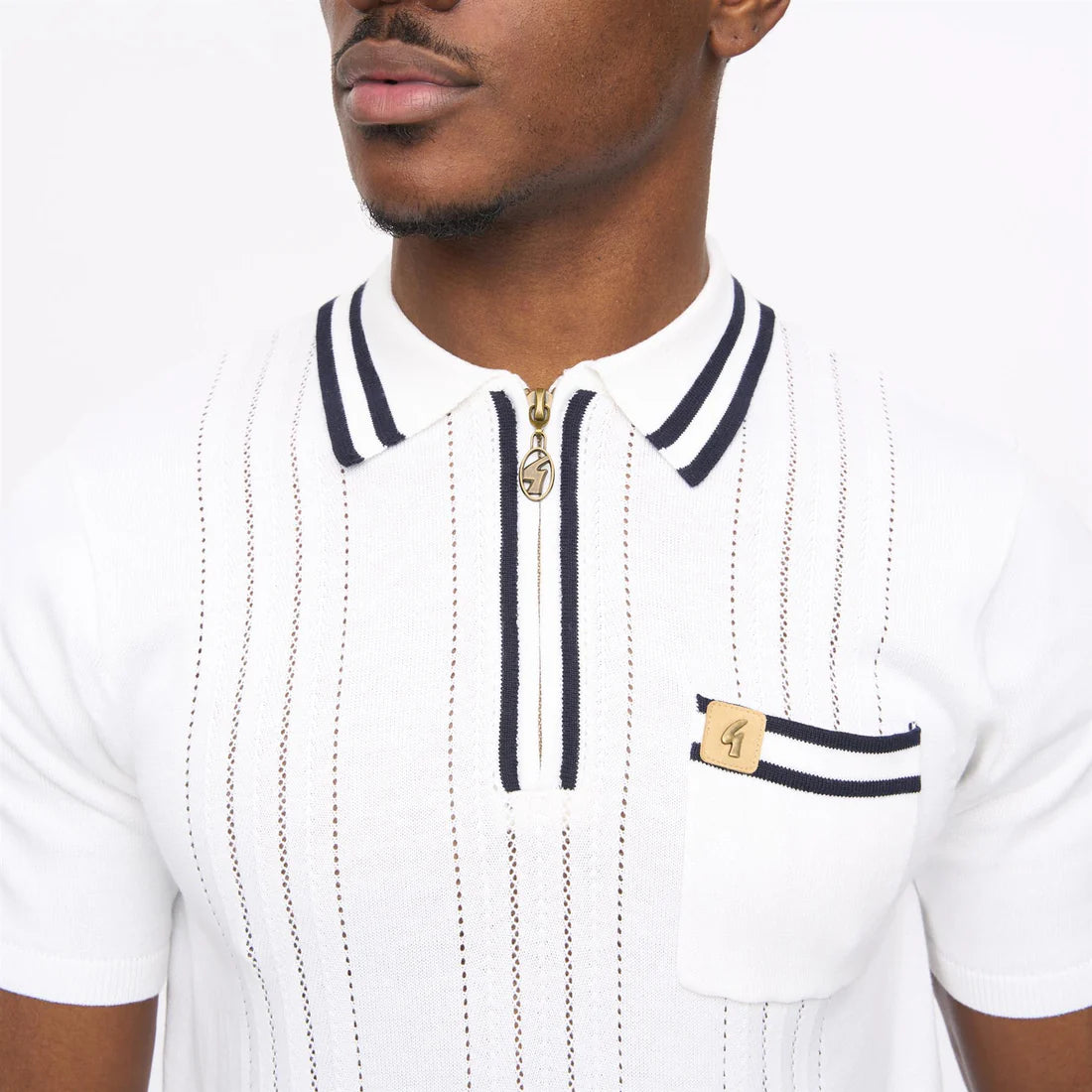 White Gabicci short sleeve zip neck knit polo shirt by Clique, featuring a classic collar and zip closure, front view.