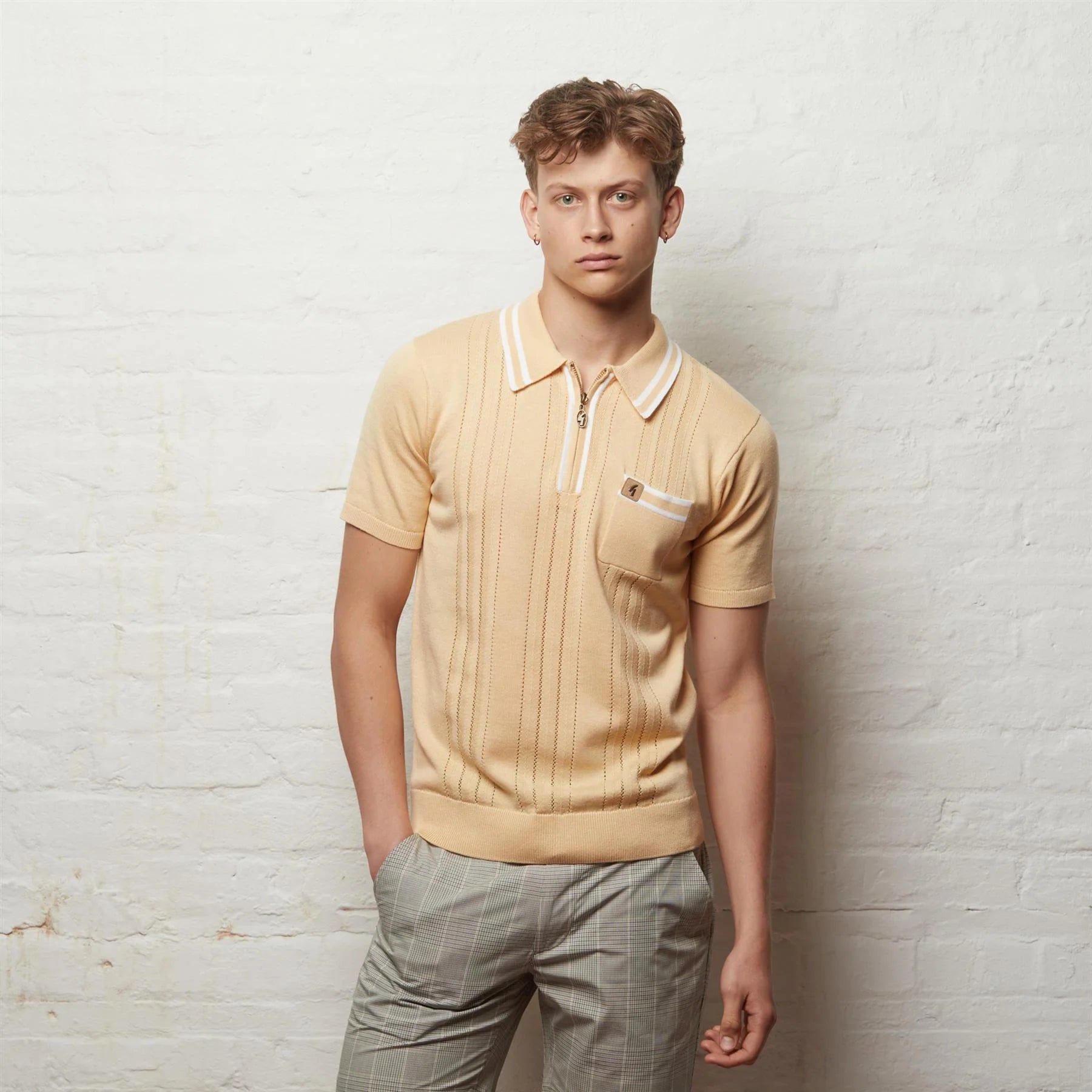 Clique Gabicci short sleeve zip neck knit polo shirt in lemon color, featuring a stylish collar and branding detail.