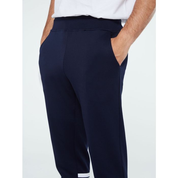 Sergio Tacchini New Reno track top in maritime blue, adrenaline ruch, and white, paired with matching track pants.