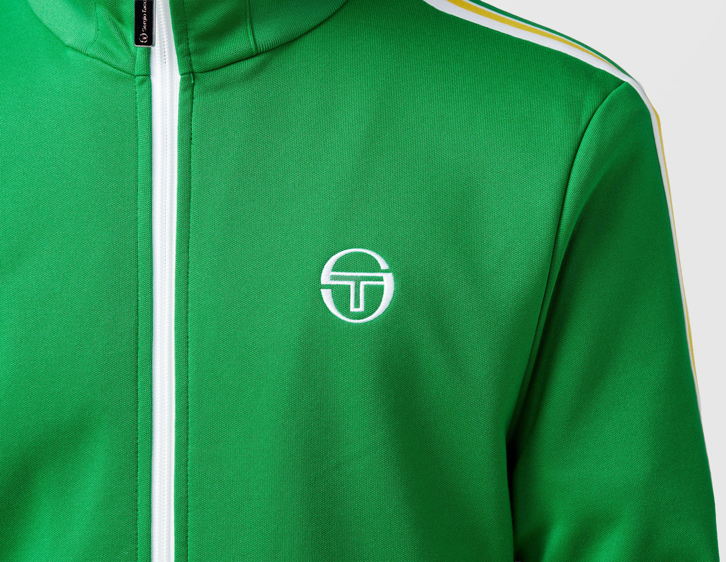 Clique Sergio Tacchini Franco track top in fern green and white, featuring sporty design and zip-up front.