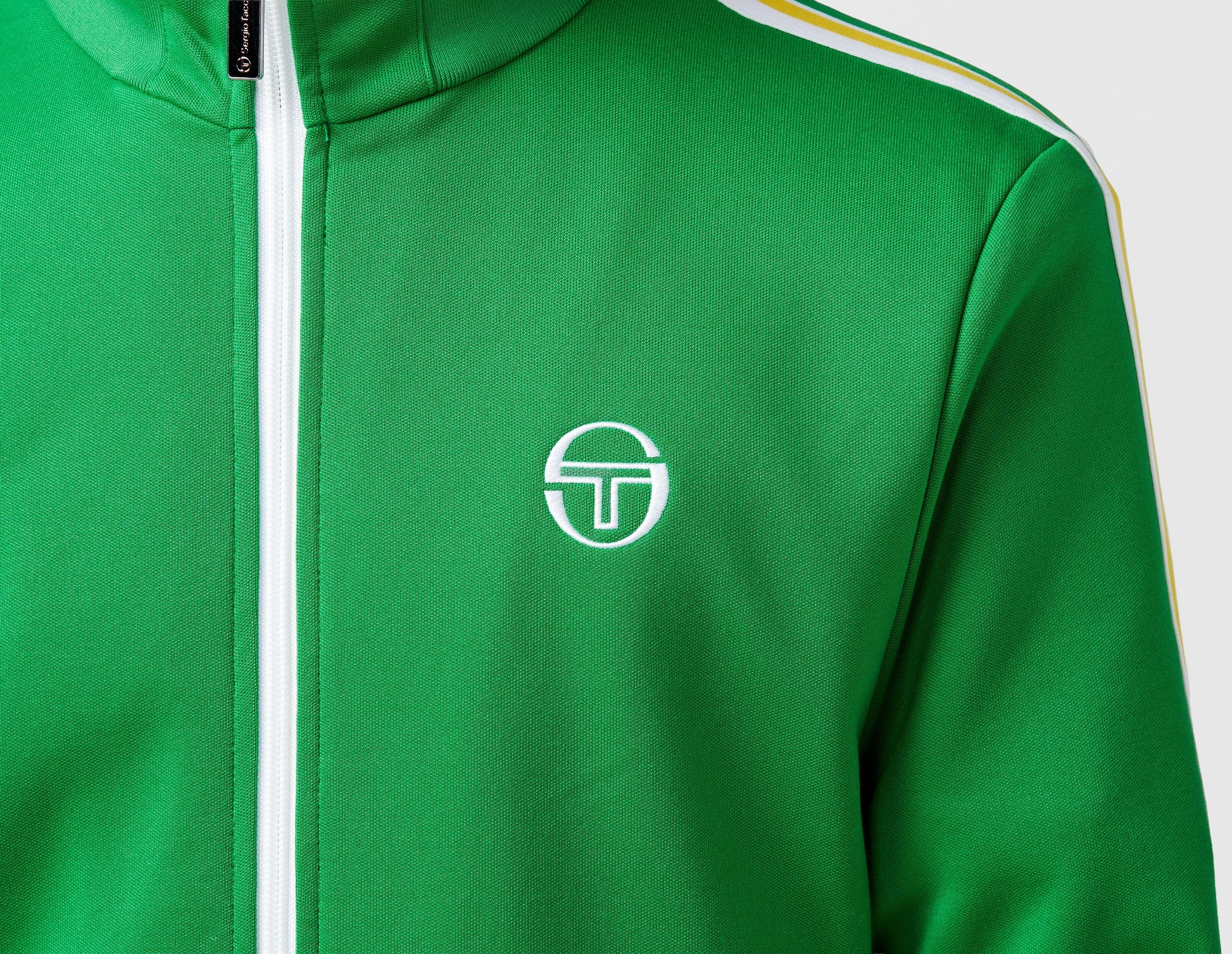 Clique Sergio Tacchini Franco track top in fern green and white, featuring sporty design and zip-up front.